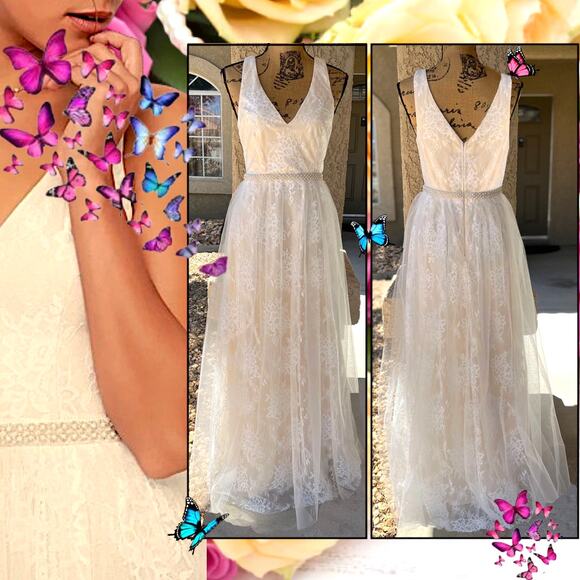 beaded dress with feathers Novias Bridal